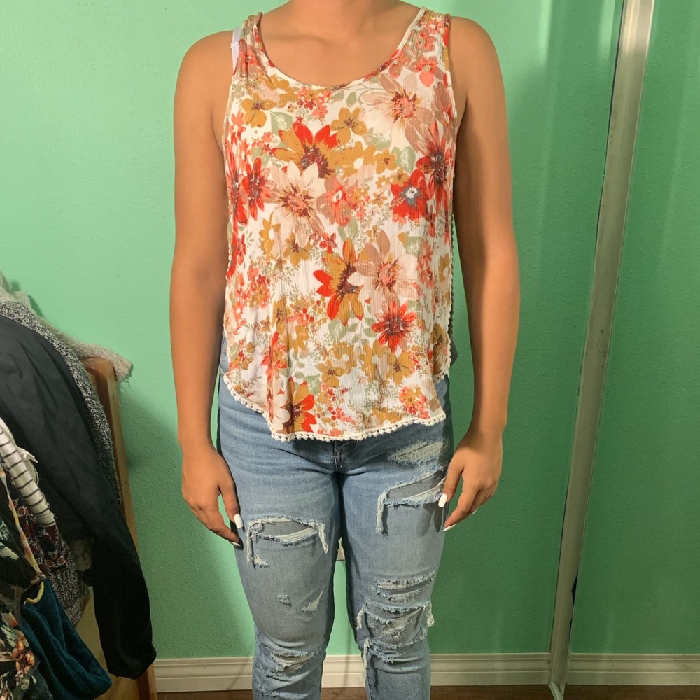 White and orange floral blouse